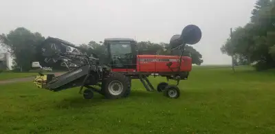 25 foot Massey 9220 swather, good condition.