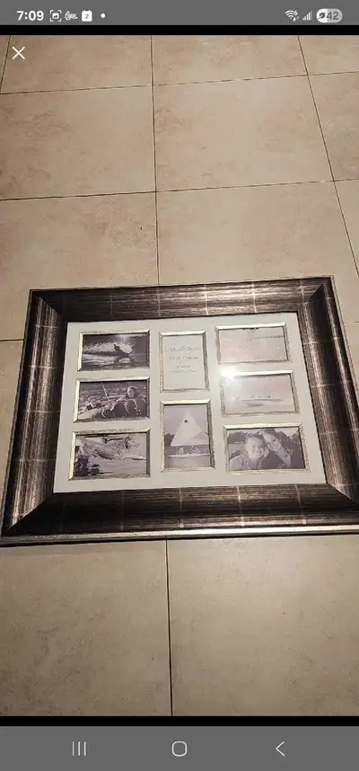 New - 8 openings for 4x6 photos. I have 2 of them. Selling at 35 ea. Purchased at a home decor store...