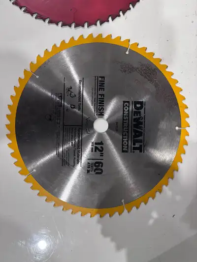 I'm selling a used DeWalt 12" 60T fine finish construction saw blade, perfect for achieving smooth c...