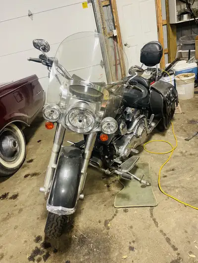 Touring Black Softail. like new !! if you are interested please TEXT. 306 452 7293