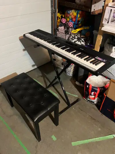 88 key keyboard w/ expensive bench that has storage, View more