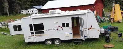 2 bunk beds , SLIDE out queen , single table bed, stored under cover. $6500 obo