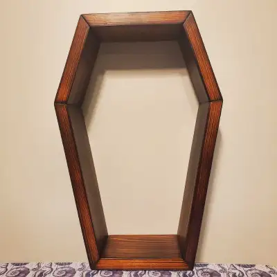 Pine coffin shelf. Wood burned and finished with Bombay Mahogany stain. H: 14.5" x W: 9.5" x D: 3.5"...