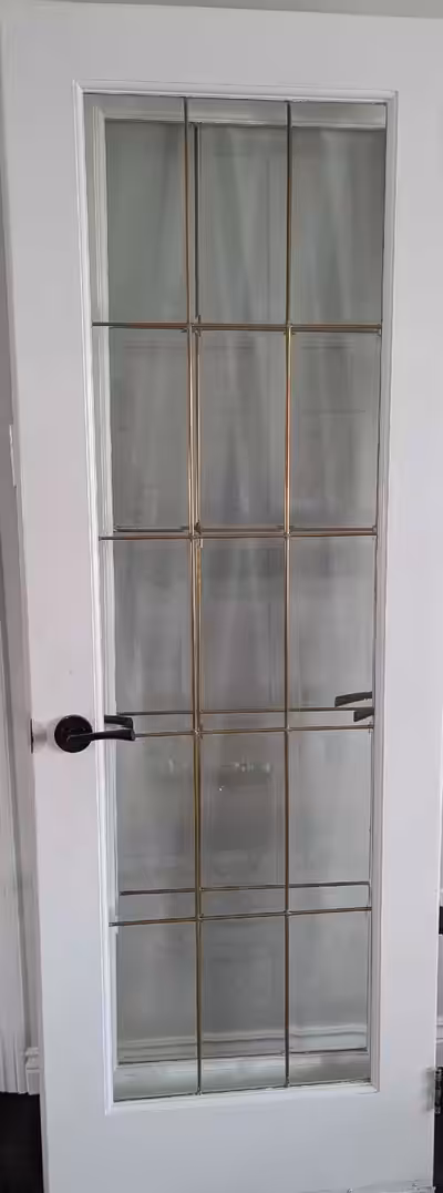 These solid doors features 15 panes of glass and a black/bronze door handle. Hinges included. In goo...
