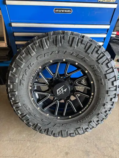 35x12.50R18 Nitto Trail Grappler tires with 60% tread remaining. And GT Aggression 18x9 wheels. 8x16...