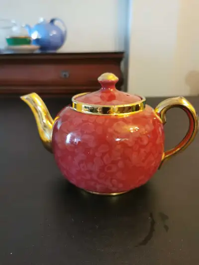 Sudlow's Burslems antique pink teapot with gold rim, View more