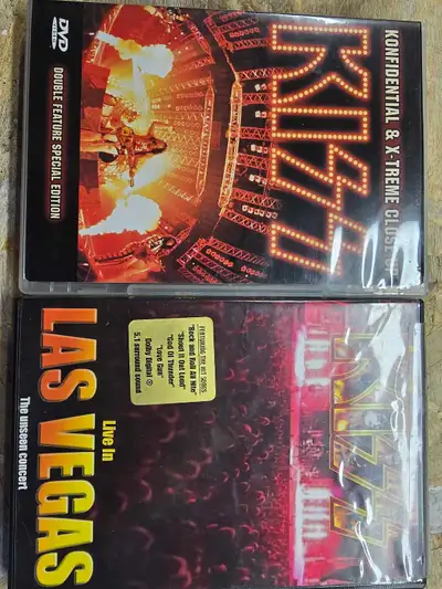 Get ready to rock with this electrifying KISS DVD lot, featuring "Konfidential & X-Treme Close Up" D...
