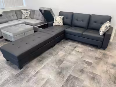 This used black sectional sofa with storage ottoman offers both style and functionality for your liv...
