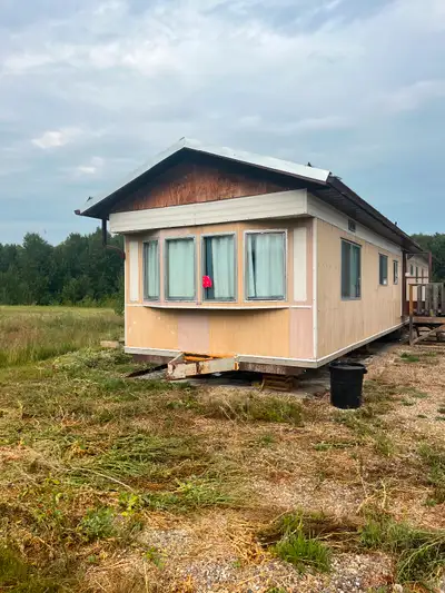 Mobile home to be moved, newer tin roof, good shape. All appliances go with including w/d nice open...