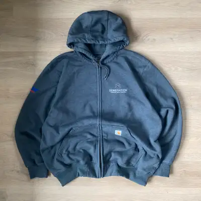 This is a pre-owned Carhartt full-zip hoodie in size XL, perfect for layering or wearing on its own....