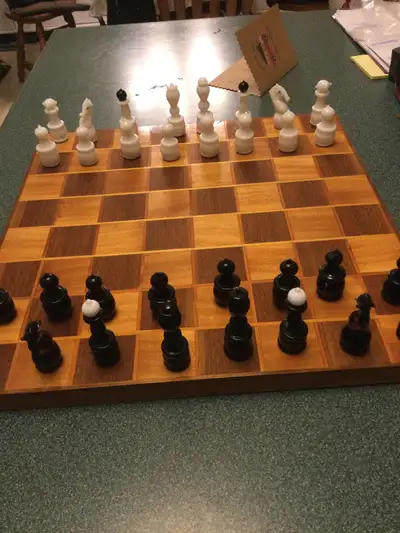 A beautiful ceramic chess set with hand made attractive inlaid board. Over 60 years old but in very...