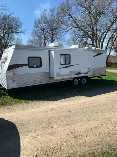 2010 Forest River Grey Wolf Lite, single over double bunks, queen bed in front, can sleep up to 9 pe...