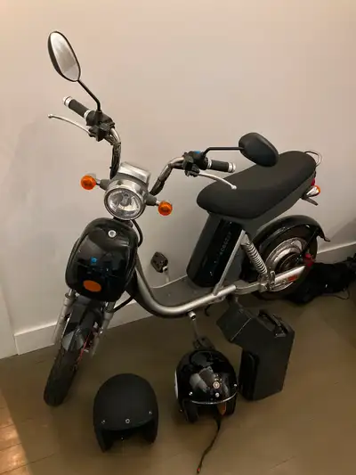 Great condition Comes with two black helmets and lock Battery 75km charge 32km speed All black Chrom...