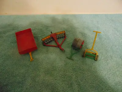 4 DINKY FARM ITEMS LAWN MOWER 384 ---$25 ROLLER 381 -- $ 25 HARROWS / DISCS 322---$25 TRAILER 319--$...