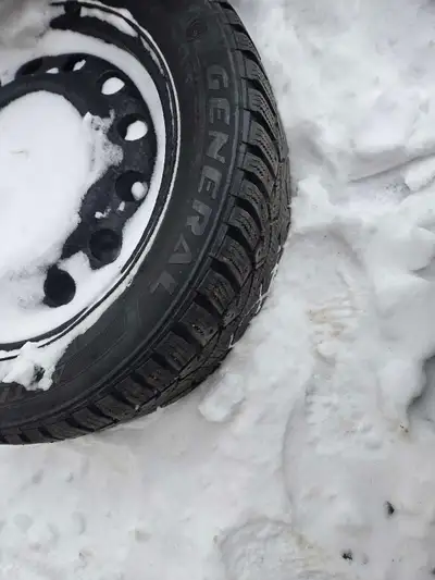 4 studded winter tires on rims Size 205 55R 16 $200