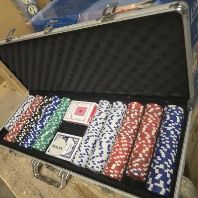 This set comes in a sturdy aluminum case and includes a full deck of cards, a dealer button, and a v...