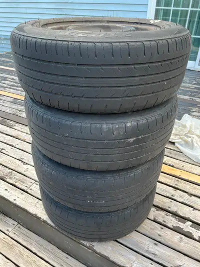 It's available if you see this ad. - 4 16 inch steel rims. - 4 Zeta 215/60R16 all season tires. Worn...