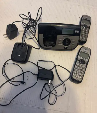 Get connected with this used Uniden DECT 6.0 digital answering system featuring two handsets for you...