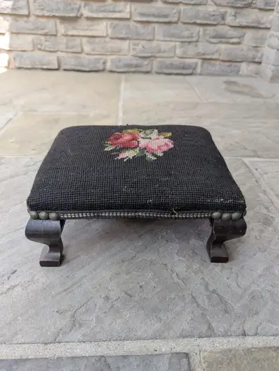 Antique small needlepoint top and wood base footstool Circa 1890's. Excellent condition for its age....