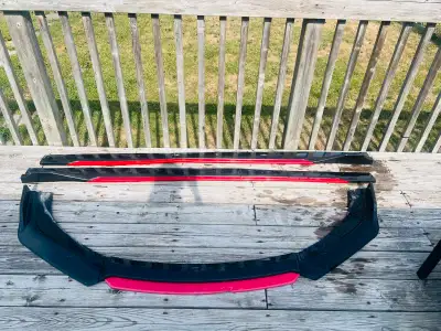 Front lip spoiler and 2 side skirts . There is small damage in front lip spoiler as you can see in i...