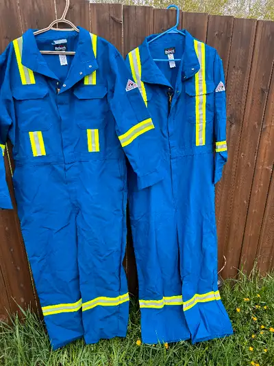 Two pairs of men’s industrial FR coveralls unused new condition. One size 48 regular other size 50 r...