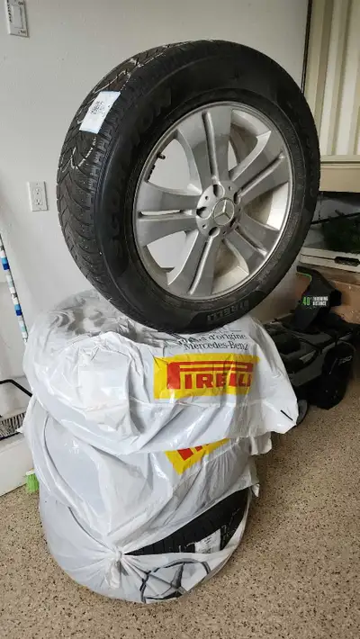 OEM Mercedes Benz winter rims with Pirelli Scorpion winter tires (+/-30% remaining). Excellent condi...