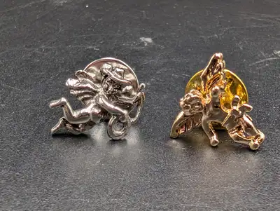 Add whimsical vintage charm to your jewelry collection with this adorable set of two vintage cherub...