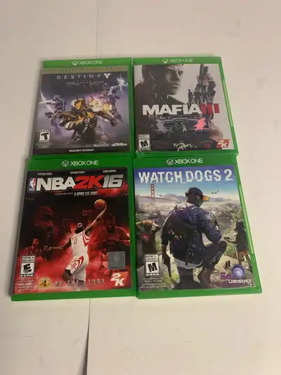 Selling a collection of used Xbox One games, including Destiny The Taken King Legendary Edition, Maf...