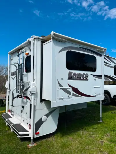 Camper is designed for short bed pickup truck, offering a slide out for in creased living space. Big...