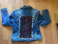 Woman denim jacket with handmade embroidery at the back and coin
