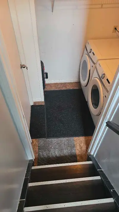 This large fully furnished basement bachelor unit offers a separate bedroom space, seprated by curta...