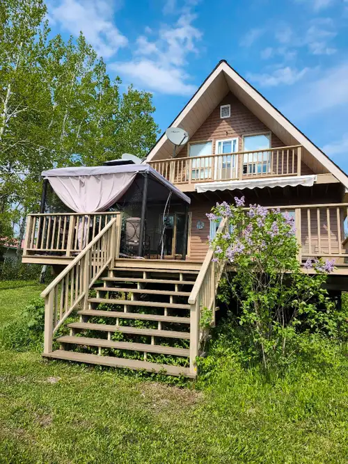 Taxes per year are $155.00. 24'x30' cottage, 1 acre lot owned, road open all year, 2 story, 3 bedroo...