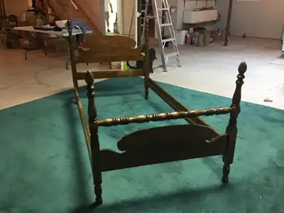 Twin size headboard and footboard with bed rails. The footboard has been refinished, and the bed rai...