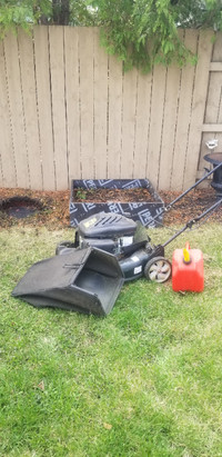 Lawn mower and bag and gerry can. Good condition.