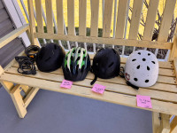 4 bicycle bike helmets and 3 combination locks