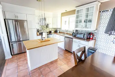 This fully furnished 4 bedroom, 2.5 bathroom home offers spacious, turn-key living in a central Kiti...