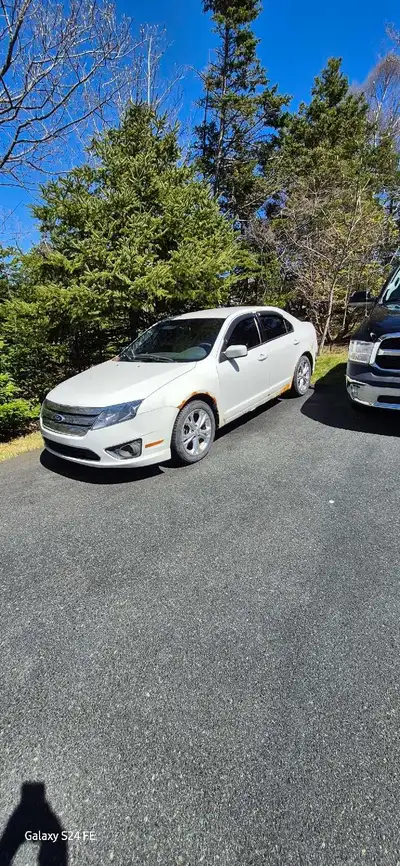 I'm selling my 2012 Ford Fusion, a reliable and stylish sedan with comfortable seating for five, a f...