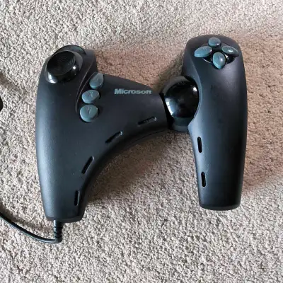 The Microsoft Dual Strike is a SideWinder controller that was released in 1999 for Windows and Penti...
