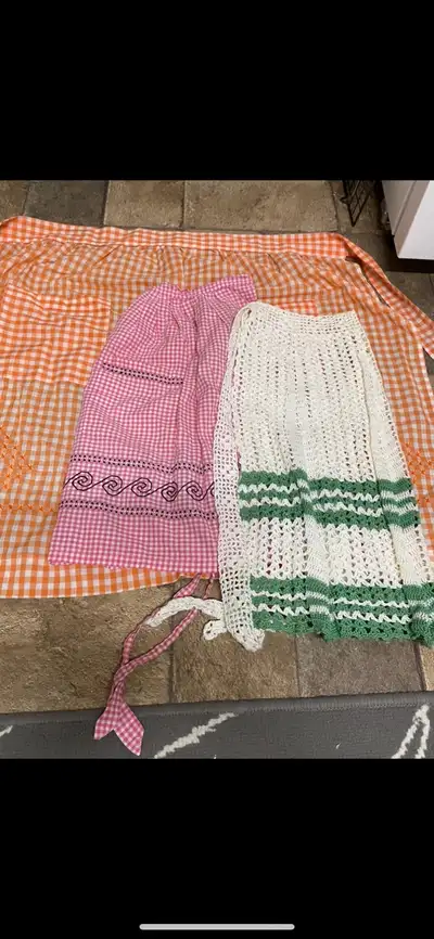 Vintage apron collection $8ea/all three for $16. All are handmade/embroidered or crochet. No stains...
