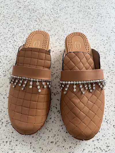 I purchased these beautiful clogs in Italy . Size 38 7-8 Paid $140 Beautiful embellishment what move...