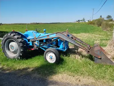 Ford tractor, new tires, bucket, blade and chains Runs good. Clarence needs a home.