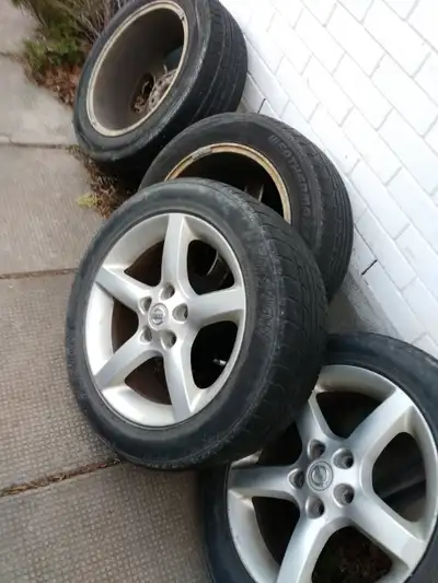 nissan oem rims + 4 winter tires 215-55r17 used but good condition nothing wrong with rims/wheel no...