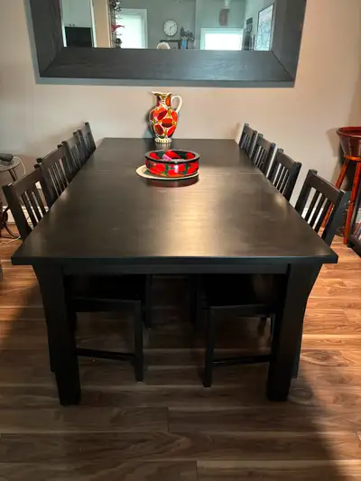 Beautiful dining table, like new. Includes 8 chairs. Dimensions, 79" long ( comes with 2 18" inserts...