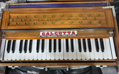 Brand new professional folding harmonium with coupler , View more