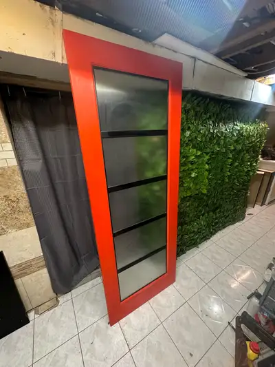 This eye-catching red interior door features stylish glass panels and measures 30x80 inches, perfect...