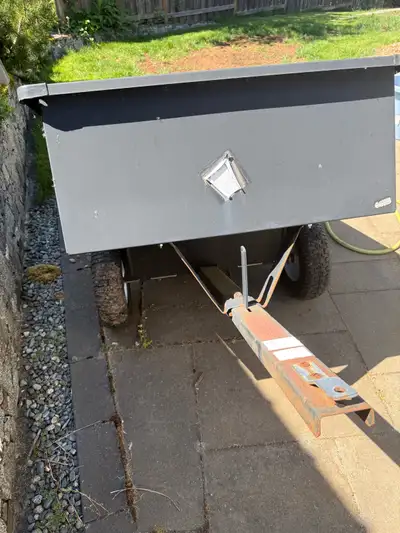 Garden Tractor sized Dumping Trailer. Inside box dimensions are 15” Deep x 34” Wide x 47-1/2” Long....