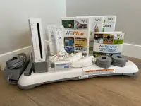 Wii w/ balance board and 3 games