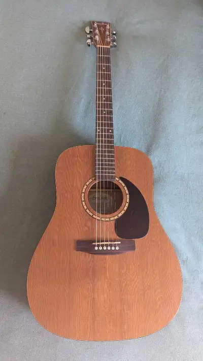 With its warm and mellow tone, the Woodland Cedar is an honest and true acoustic guitar. With a Cust...