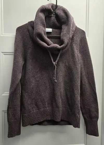This is a Columbia cowl neck sweater, perfect for cozy days! It's in used-good condition, showing so...