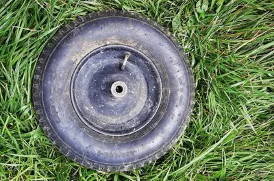 One spare wheelbarrow wheel with tire. Air field tire. Perfect for wheelbarrows.